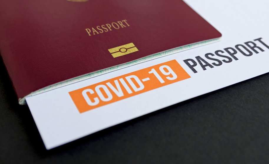 close-up-image-of-passport-with-covid-test-report-3YBZFBB