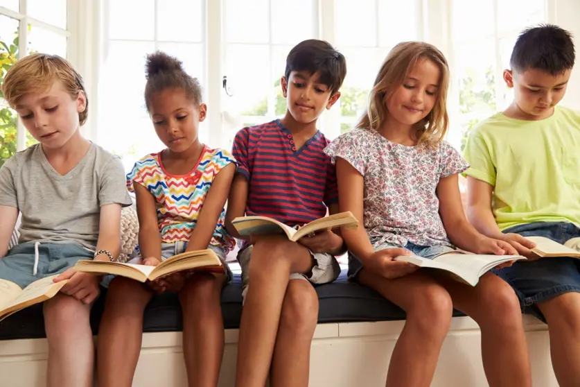 group-of-multi-cultural-children-reading-on-window-2021-08-26-16-13-15-utc (1)