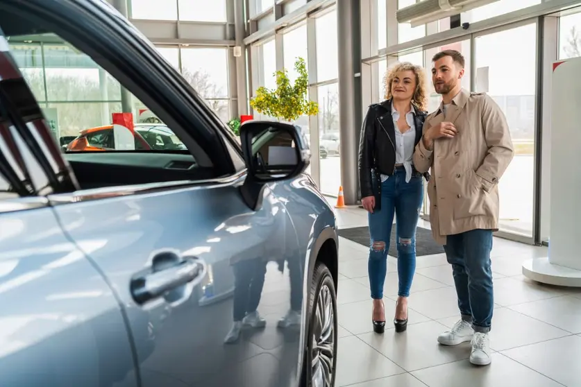 beautiful-couple-in-car-dealership-chooses-car-2022-02-02-22-05-45-utc (1)