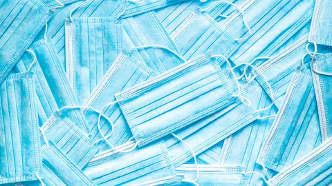 Blue paper face masks. Corona virus protection. Top view.