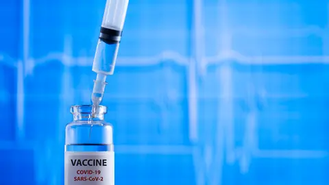 Coronavirus COVID-19 vaccine.Vaccine and syringe injection