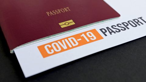 close-up-image-of-passport-with-covid-test-report-3YBZFBB