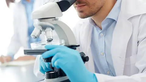 Male scientist studyin new substances in lab