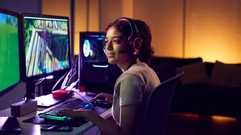 teenage-girl-wearing-headset-gaming-at-home-using-2022-02-08-22-39-25-utc (1)