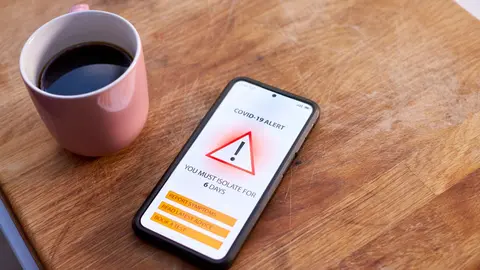 close-up-of-mobile-phone-with-covid-19-track-and-t-2022-01-21-04-05-45-utc (1)