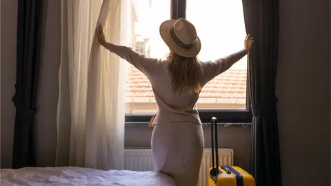 portrait-of-tourist-woman-standing-nearly-window-2023-11-27-05-37-23-utc (1)