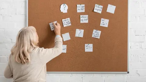 retired-woman-with-alzheimer-disease-writing-on-pa-2023-11-27-05-35-03-utc (1)