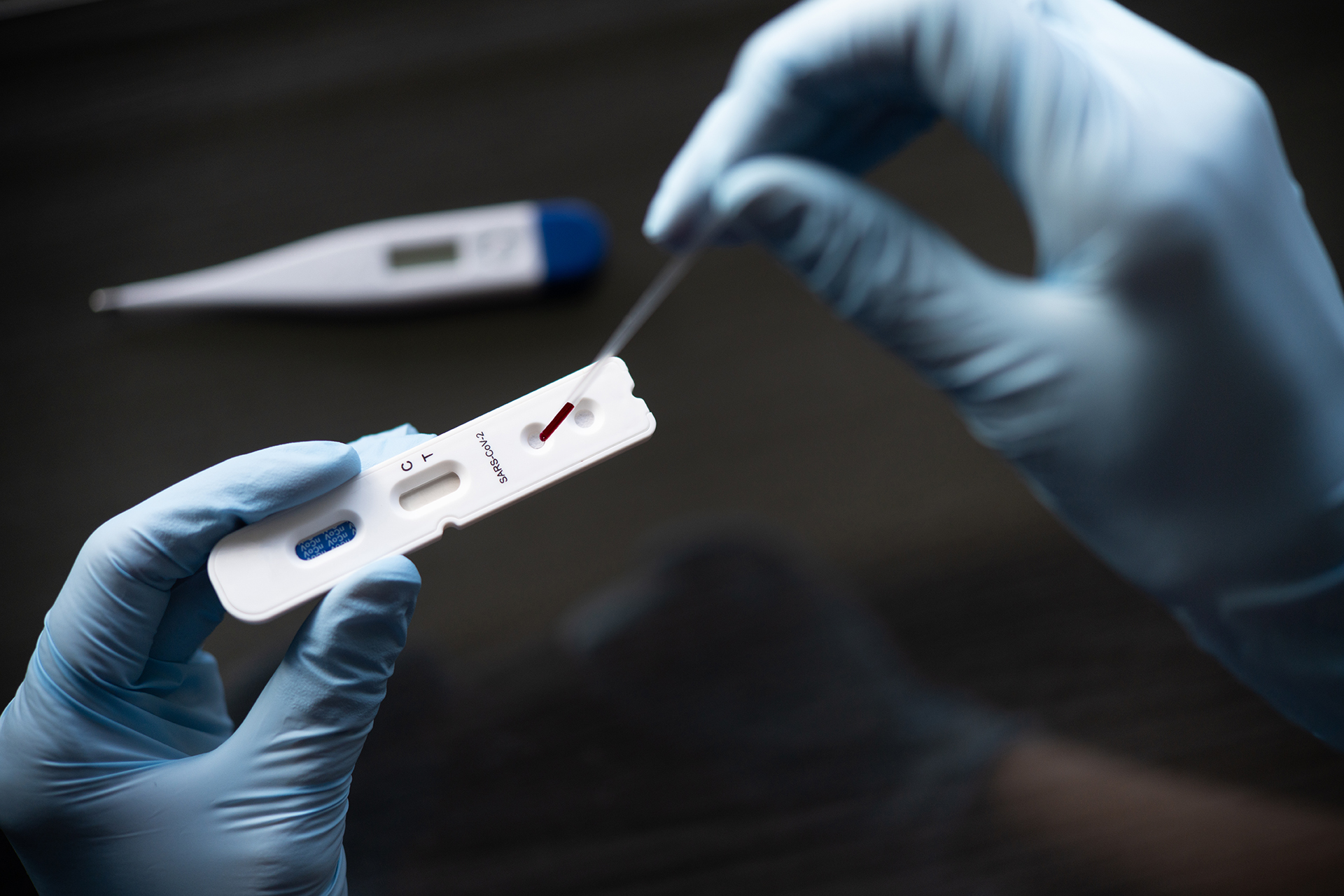 Doctor testing using the rapid test device for COVID-19, the new 2019 coronavirus